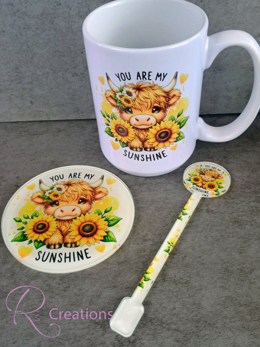Highland cow and sunflower drinkware set.