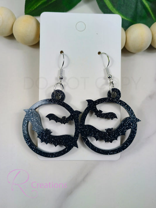 Bat acrylic black onyx glitter earrings.