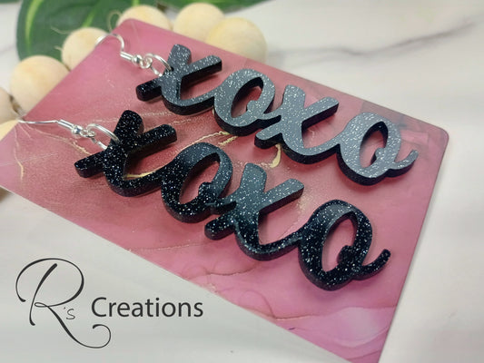 Xoxo black acrylic dangle earrings.